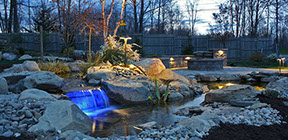 Aquascape landscape koi pond and stream, color led landscape lights, fire pit, pavers patio and sitting wall build in highland ny 12528