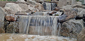 Aquascape build a kpoi pond day, 3 tier waterfall and stream in backyard with landscaping build in goshen NY