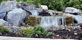 Small backyard garden waterfall with koi pond build in lagrangeville NY