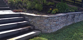 Natural Blue stone retaining wall with landscaping build in millbrook ny hudson valley area