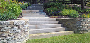 Staircase with blue stone natural stone and small garden wall with landscaping build in millbrook ny 