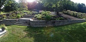 Natural blue stone retaining wall with blue stone steps, landscaping, irrigation and natural slate path build in millbrook NY