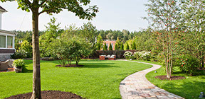Custom walkway nesxt to landscaping and mature trees, recently mowed lawn in poughkeepsie ny and newpaltz area